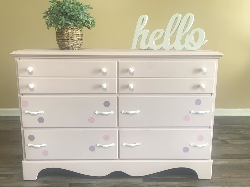 dresser after pink with white hardware and pruple and pink polka dots.
