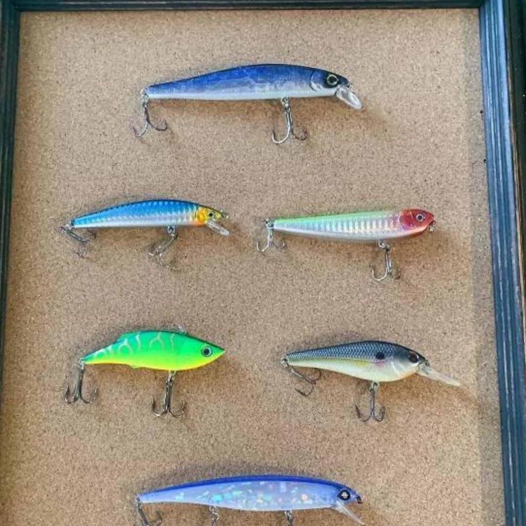 Repurposed Picture Frame Lure Wall Decor placing lures on cork
